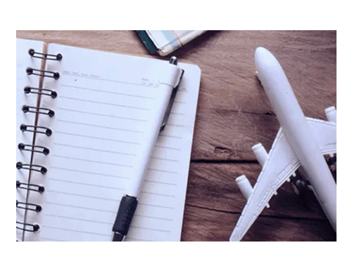 Model plane next to notepad