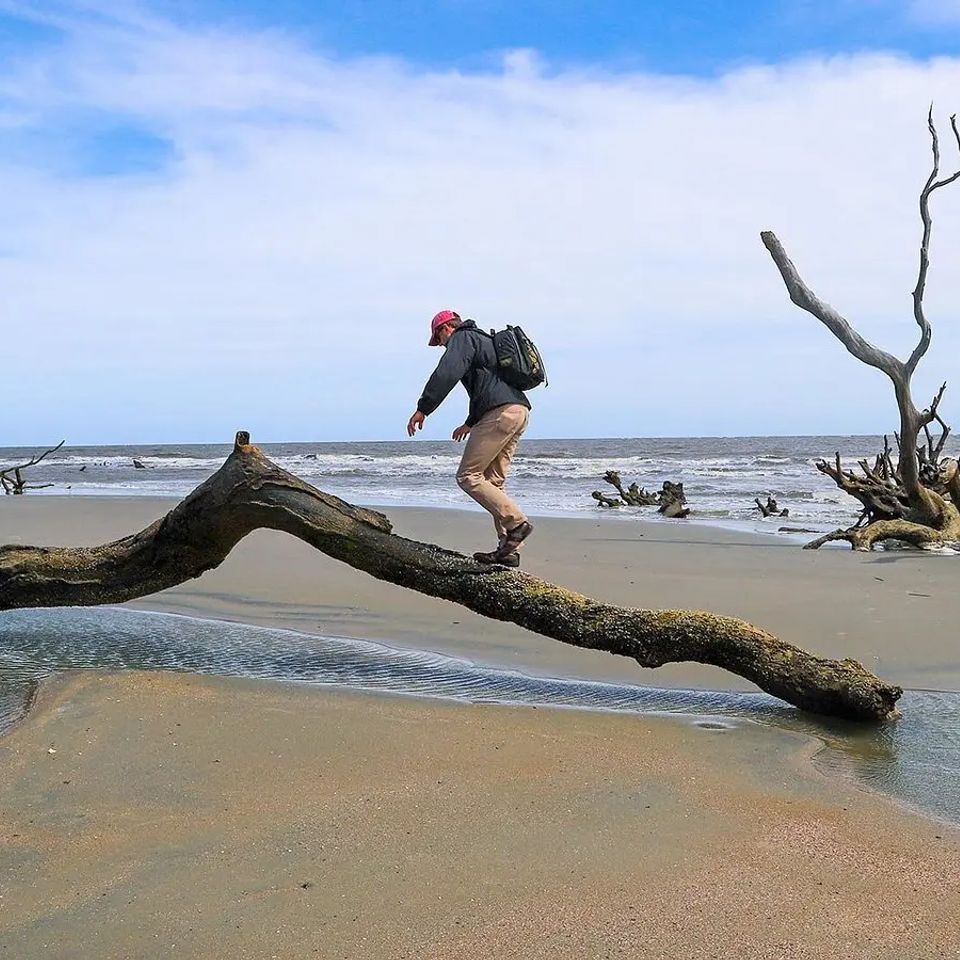 Person exploring a remote beach near Charleston, South Carolina, accessible by private boat