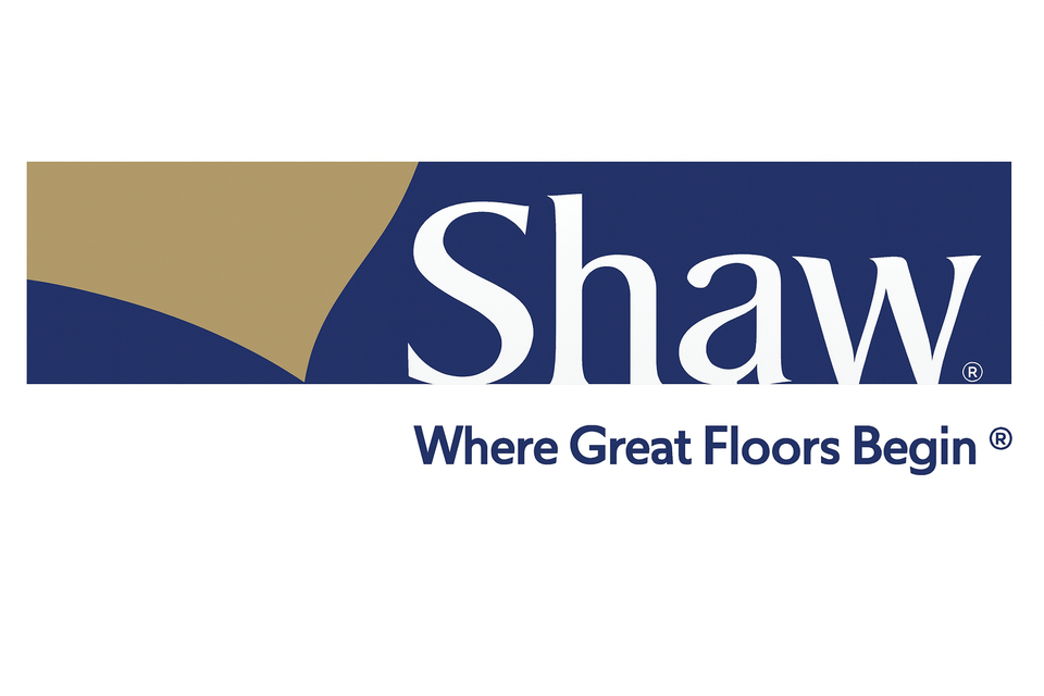 Shaw logo with white “Shaw” text on a dark blue background, tan and blue design element above, and slogan “Where Great Floors Begin®” below.