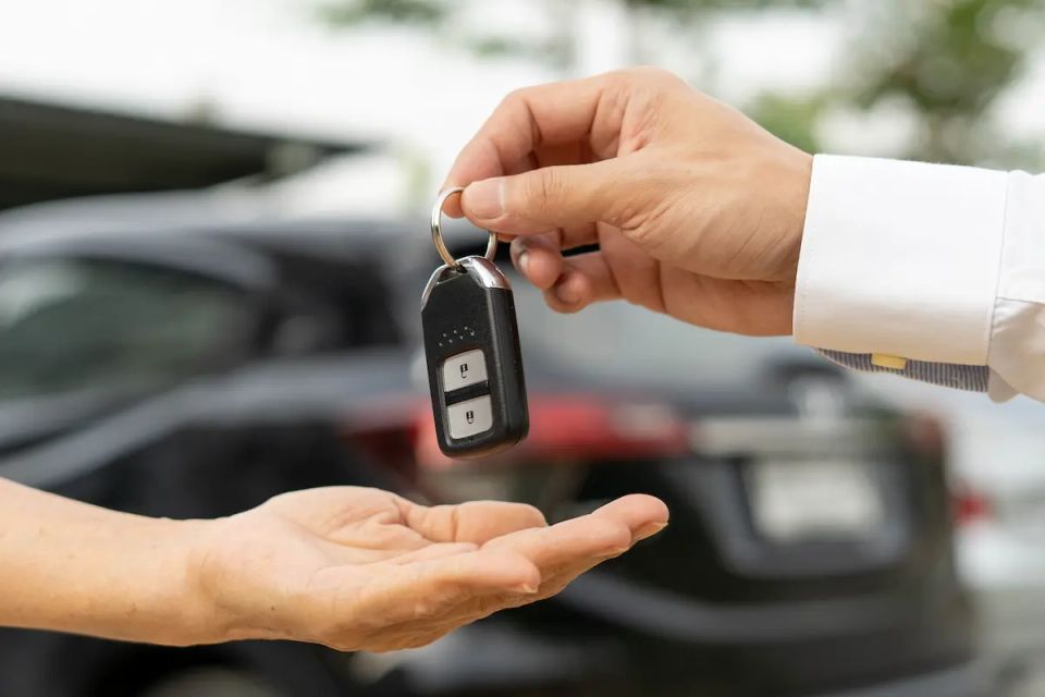 Vistacreate 613889280 stock photo tenant receives car keys car rental company entering rental contract