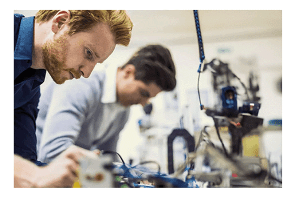 Two men working on electrical