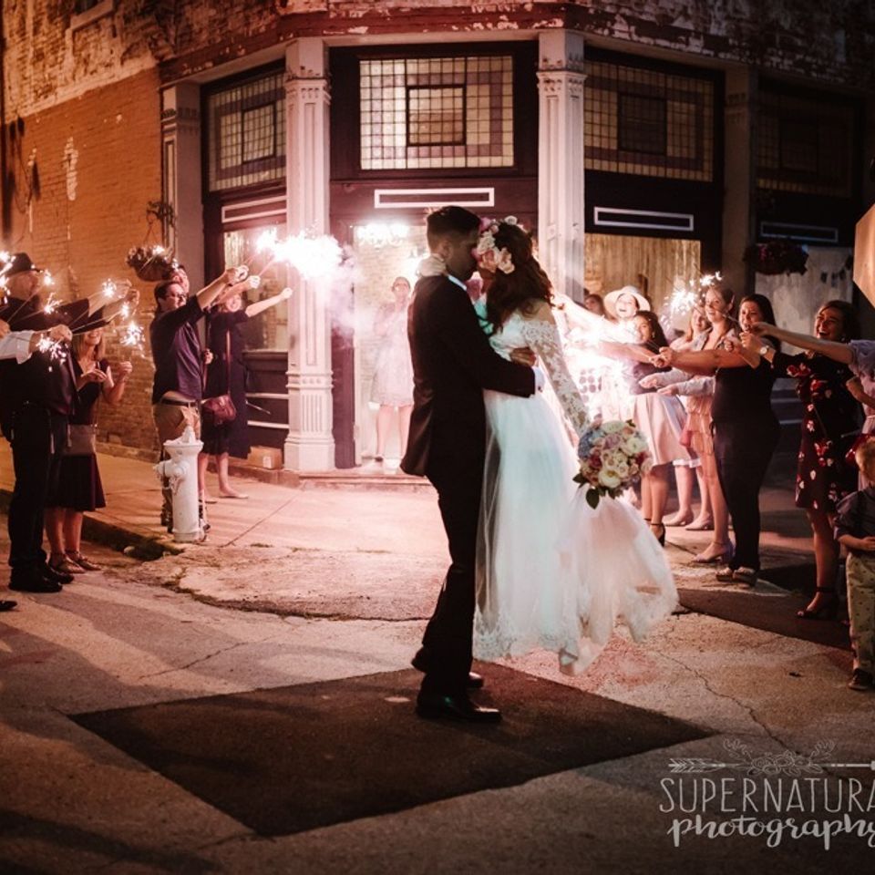 groom kissing bride at the coleman vault