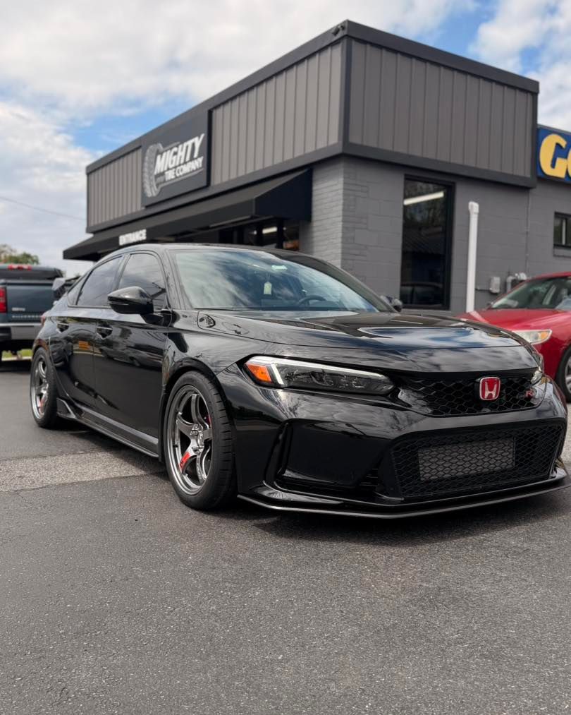 Black Honda Civic Type R with chrome wheels parked outside Mighty Tire Company in Claymont DE