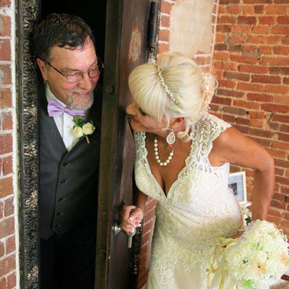 Bride and groom hide and seek in the vault
