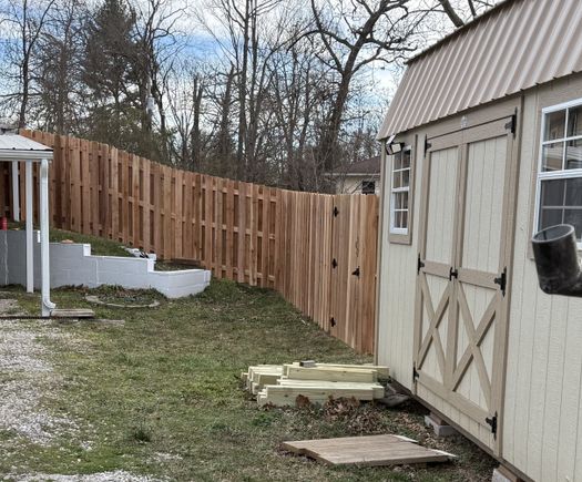 Privacy fence between shed and house