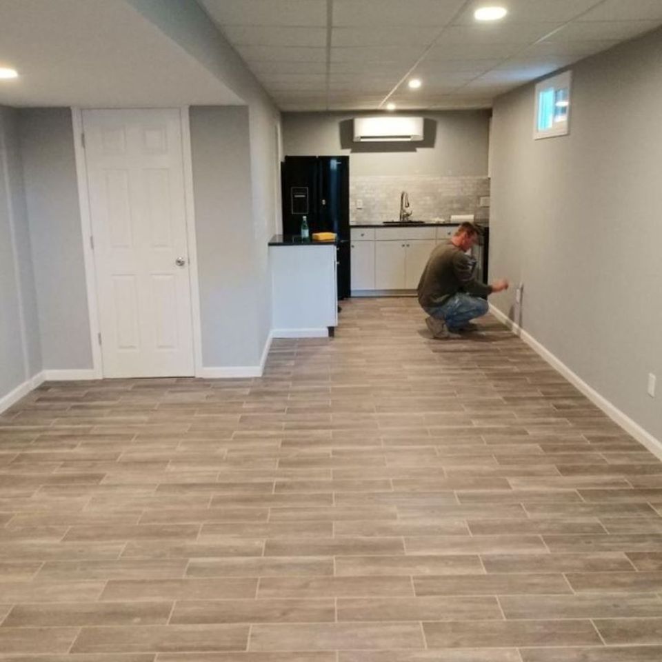 Basement finishing with new tile flooring and kitchenette by general contractor in Suffolk County NY