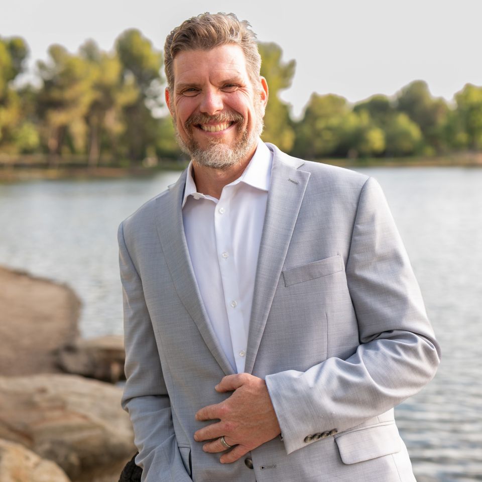 Man posing by lake