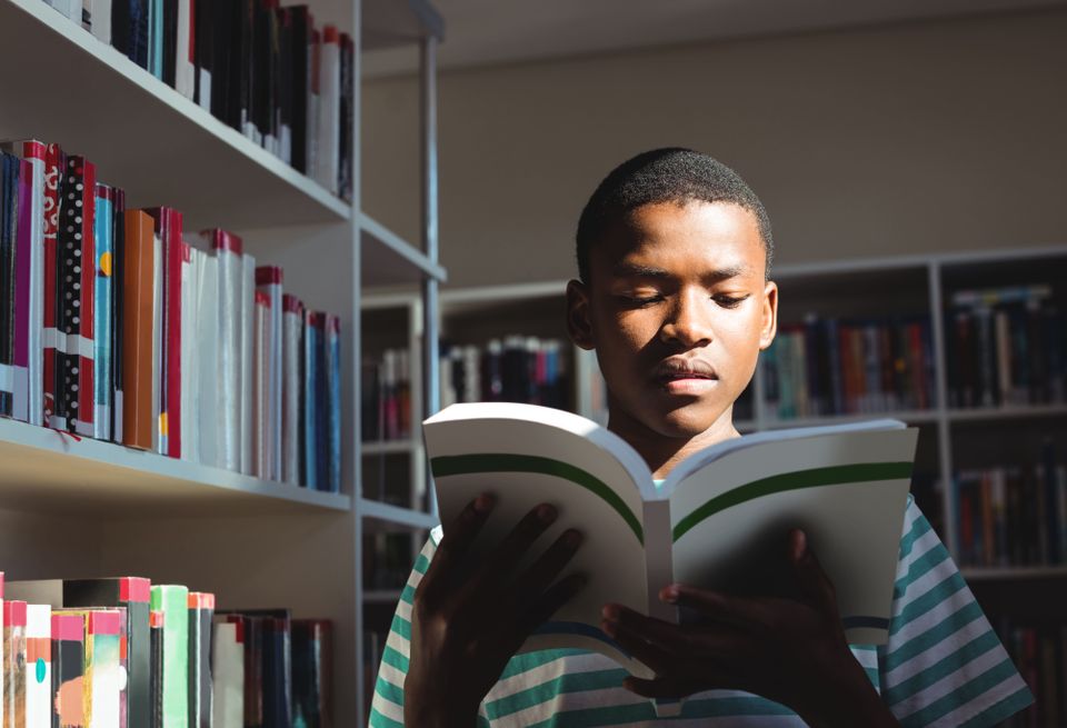 Attentive schoolboy reading book in library 2025 04 04 18 08 52 utc(1)
