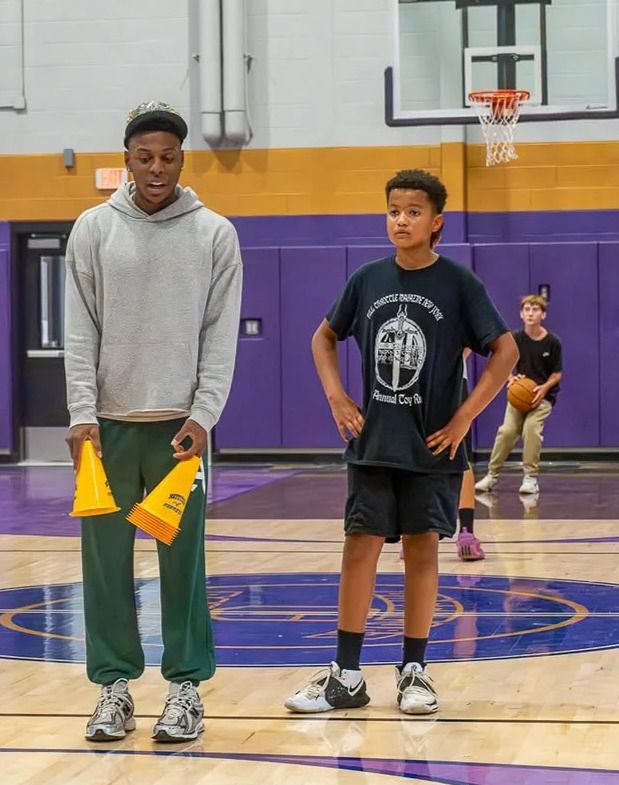 Xavier Allen coaching a student 