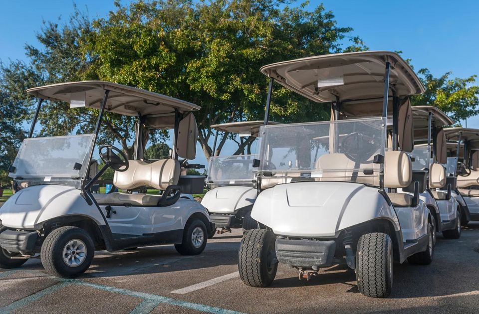 Best mobile golf cart repair in New Orleans and the Northshore – three parked golf carts representing Neighborhood Golf Carts