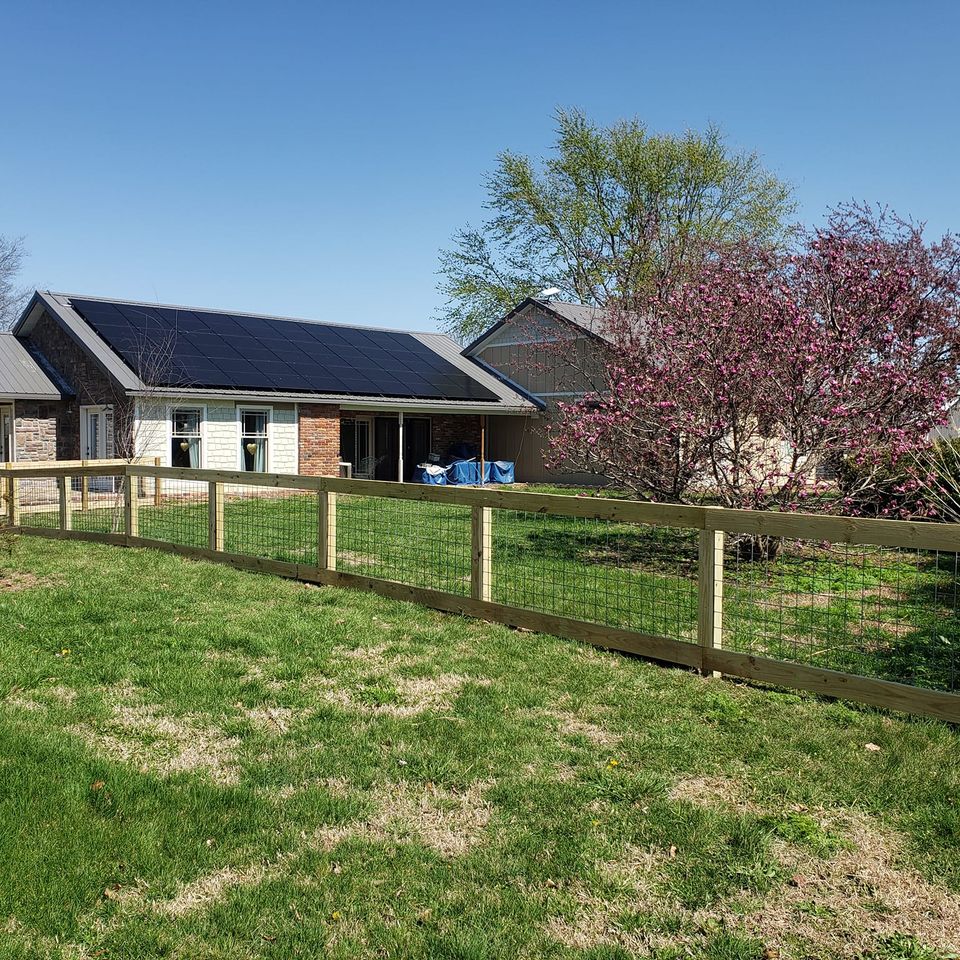 custom wooden and wire transition farm fence