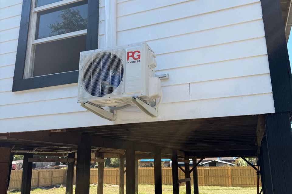 Split unit air conditioner system with indoor air handler and outdoor compressor