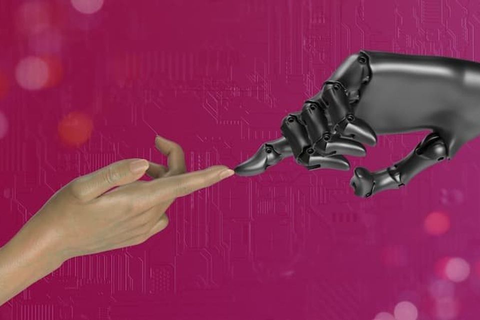 Human index finger touching robot index finger 