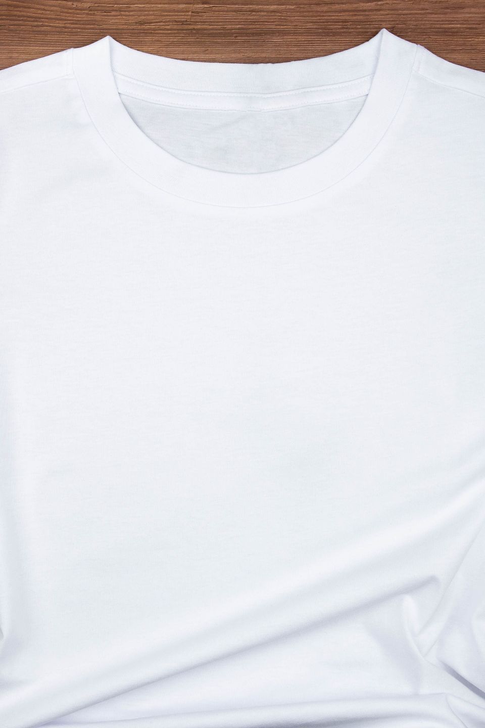 White womens cotton tshirt mockup on wooden background