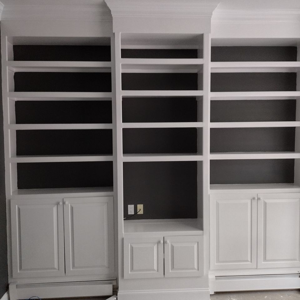 Bookshelf painted white, done by Taurus Contracting Inc. of Suffolk County , NY