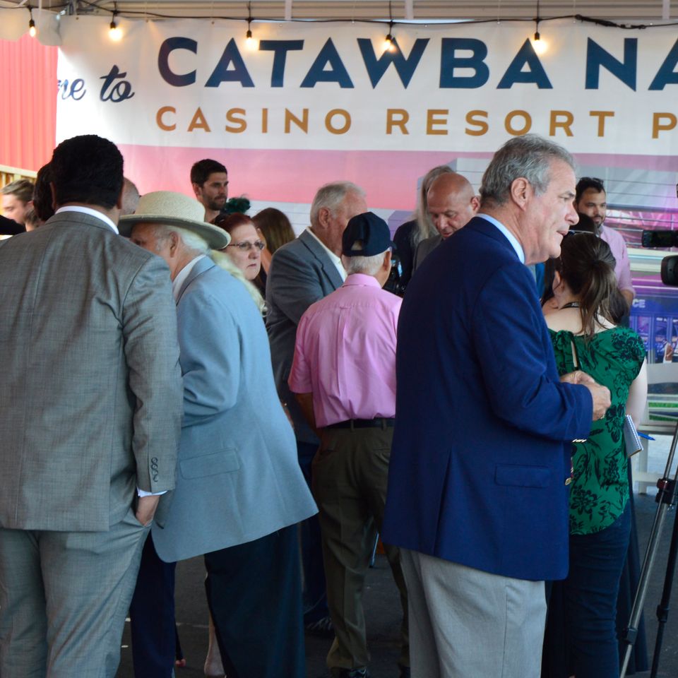 Media and dignitaries converge after ceremony concludes