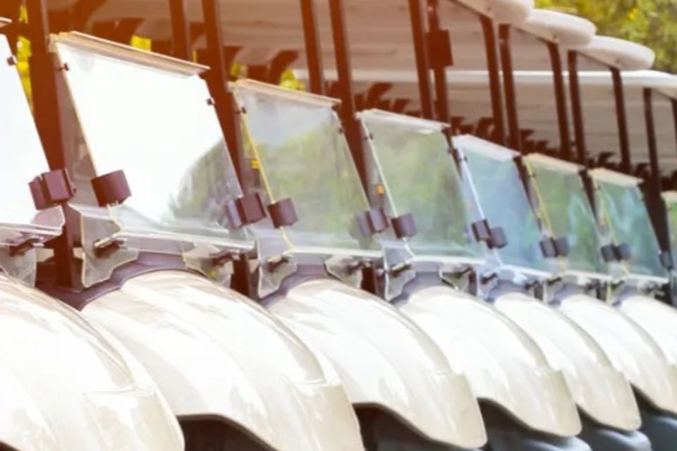 Fleet of golf carts lined up at a golf course for routine maintenance in Slidell, LA