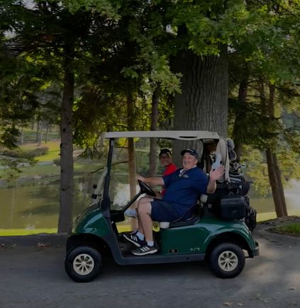 Tom in golf cart