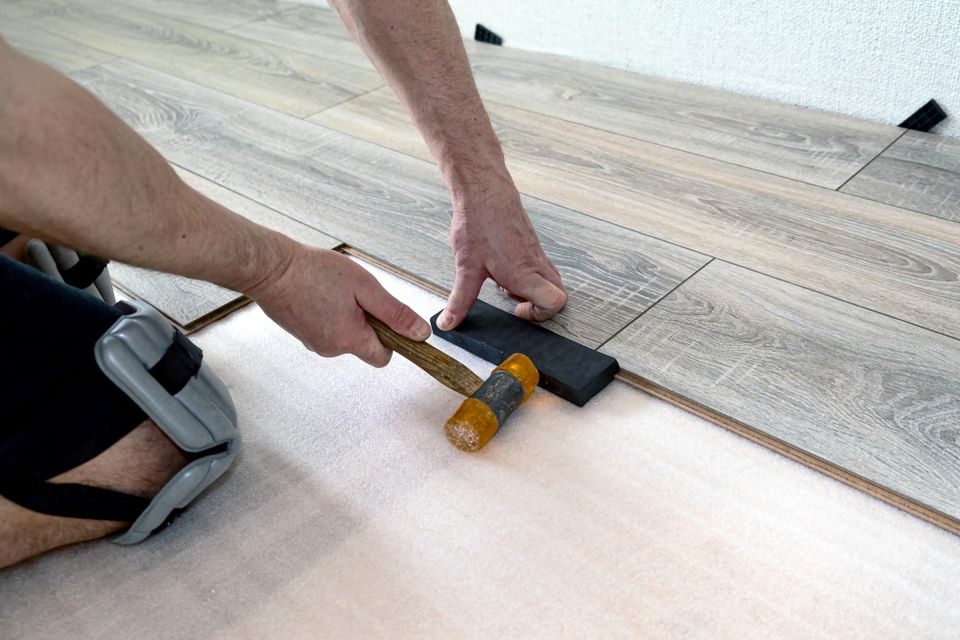 Professional hardwood floor board replacement and seamless repair completed by Concord Carpet And Hardwood.