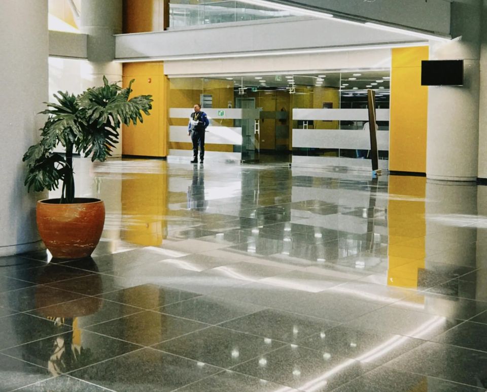 Corporate office floor cleaning, commercial tile buffing, and lobby janitorial services.