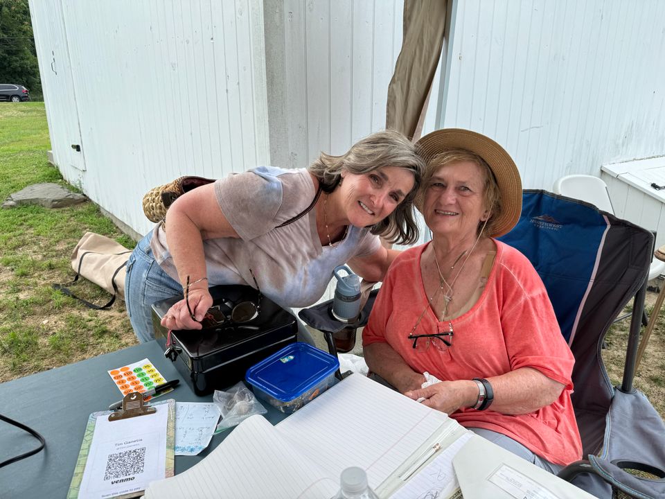 A community member greets Mary Cunningham.