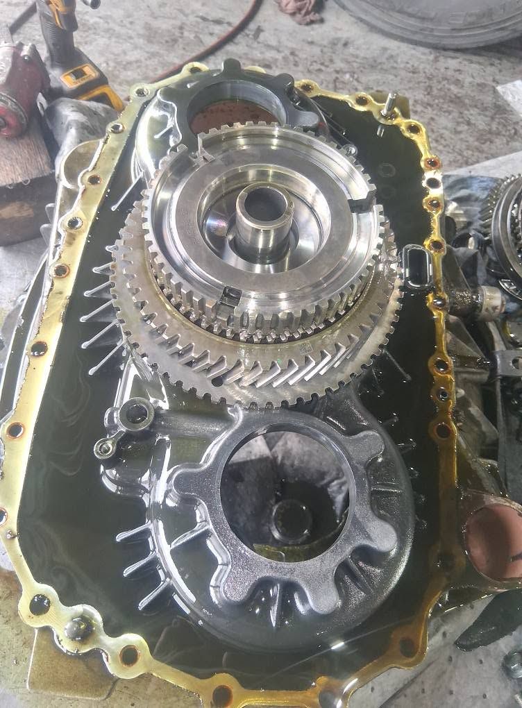 Diesel engine timing gears and internal components exposed during truck engine repair in Arab Alabama