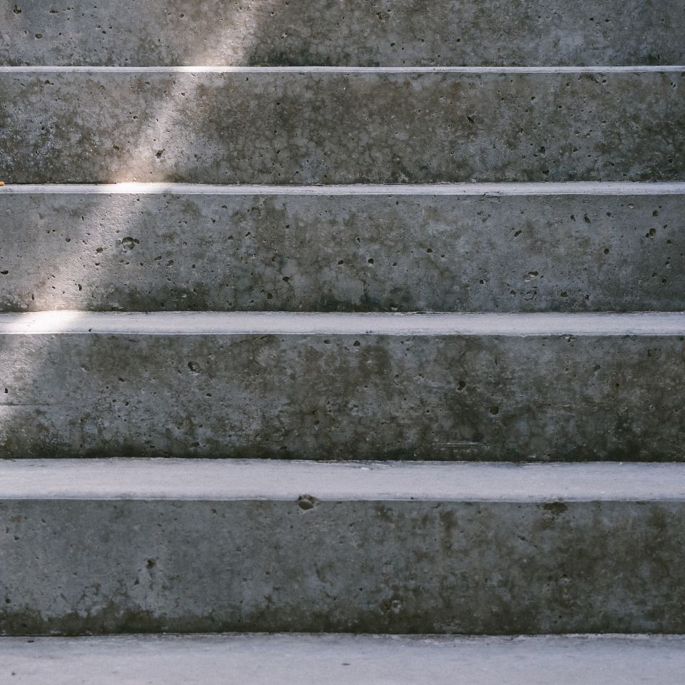Custom masonry steps and reinforced concrete stairway for a residential landscape project in Placer County by Roseville Concrete Solutions.