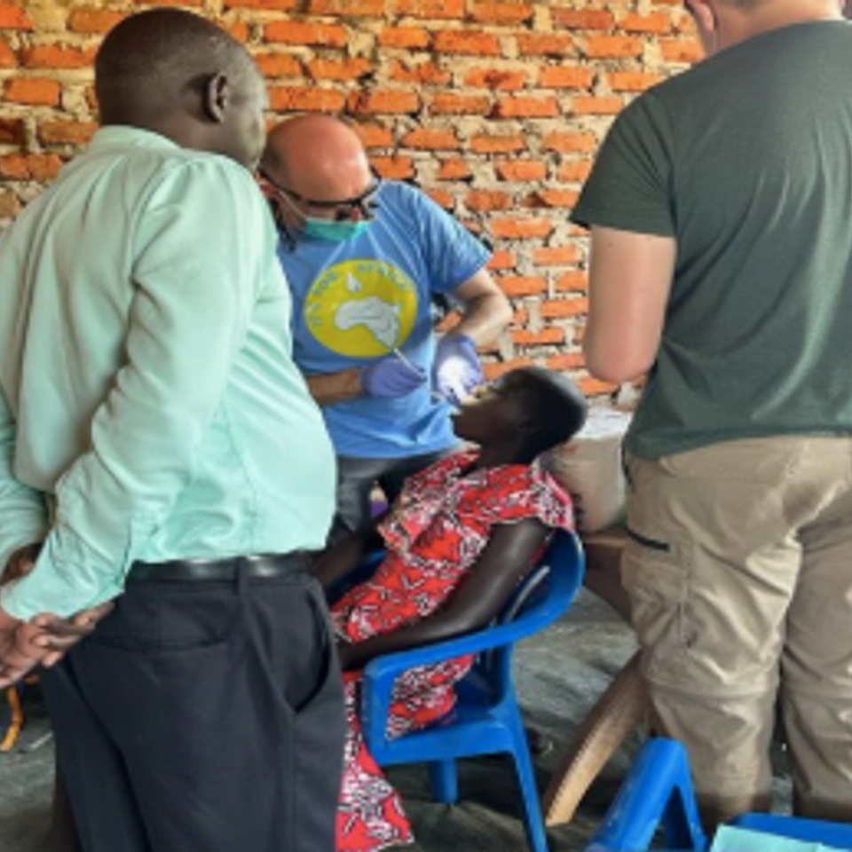 Ugandan dentist observing technique of dr. hansen