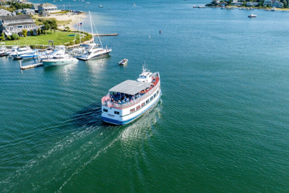 Sight Seeing boat traveling out of the harbor, from an aerial view