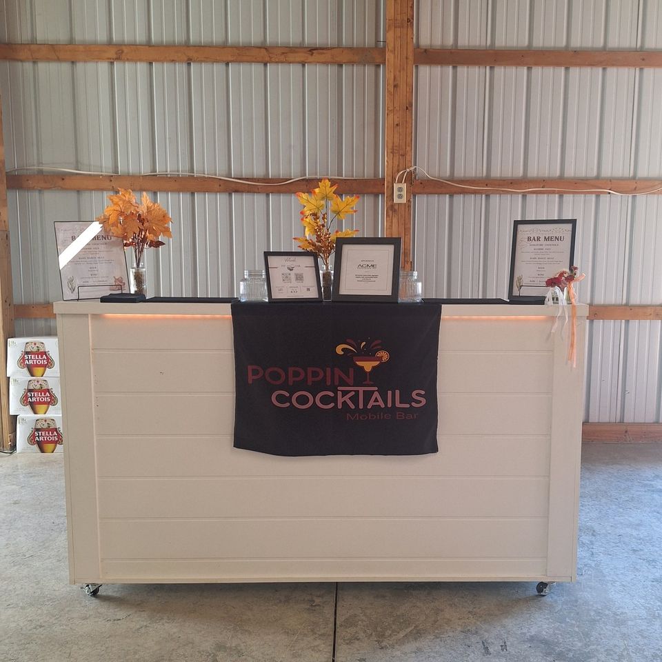 Front view of a 6ft wooden bar with signage and drink menus display