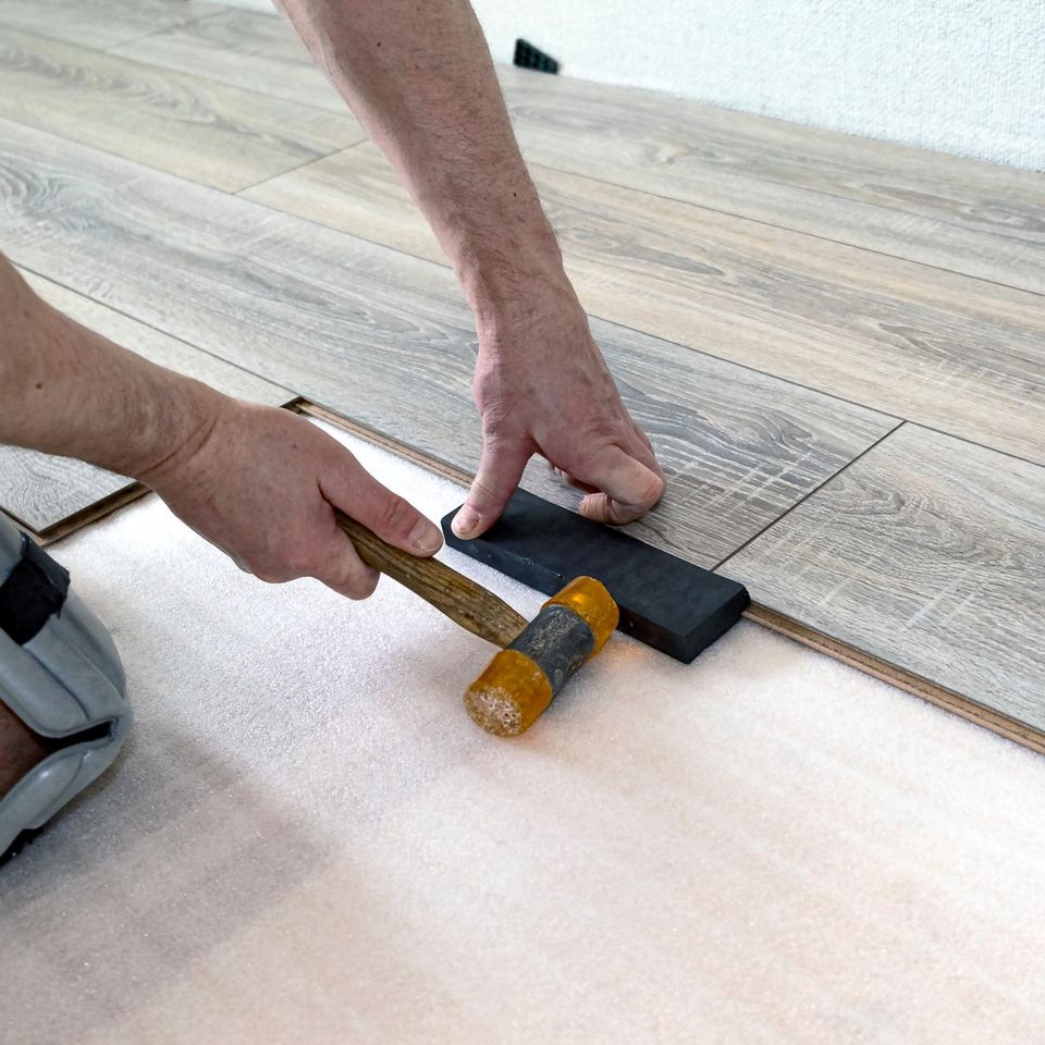 Professional hardwood floor board replacement and seamless repair completed by Concord Carpet And Hardwood.