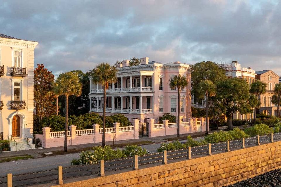 Elegant historic mansions along the Charleston Battery at golden hour
