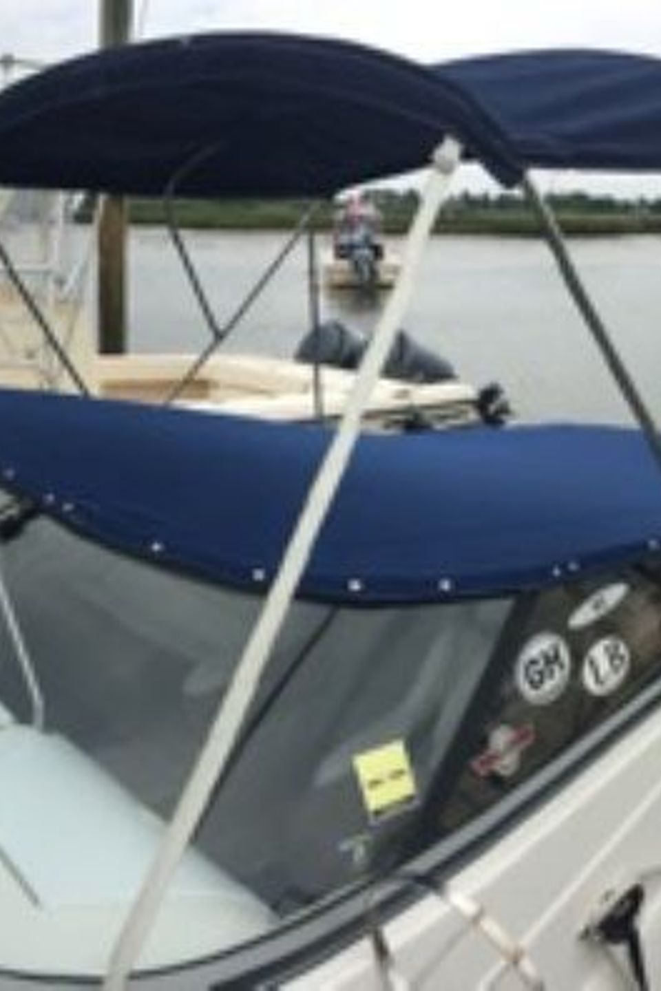 Speedboat canvas snap cover view from front starboard side showing most of boat 2