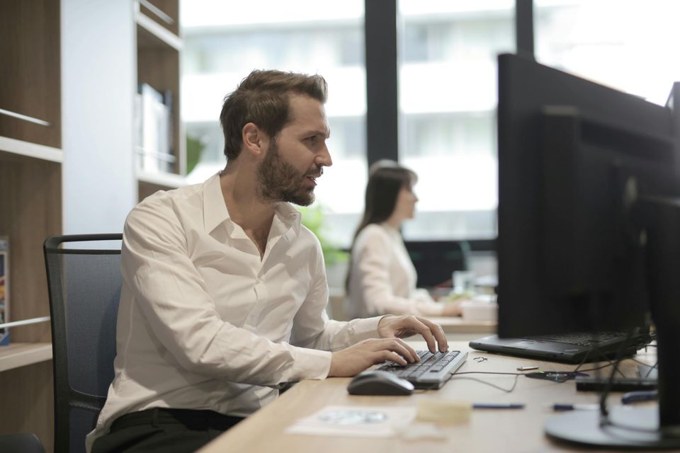 Man working at computer monitor