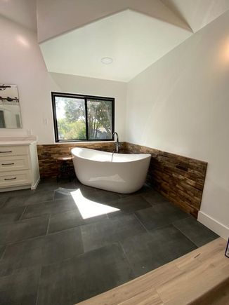 Bathroom with modern long soaking tub