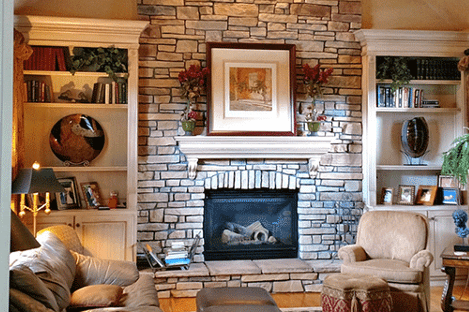 Living room with fireplace before
