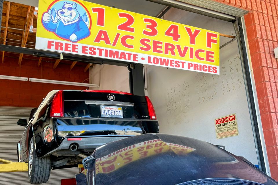 Image of cars getting their AC inspected