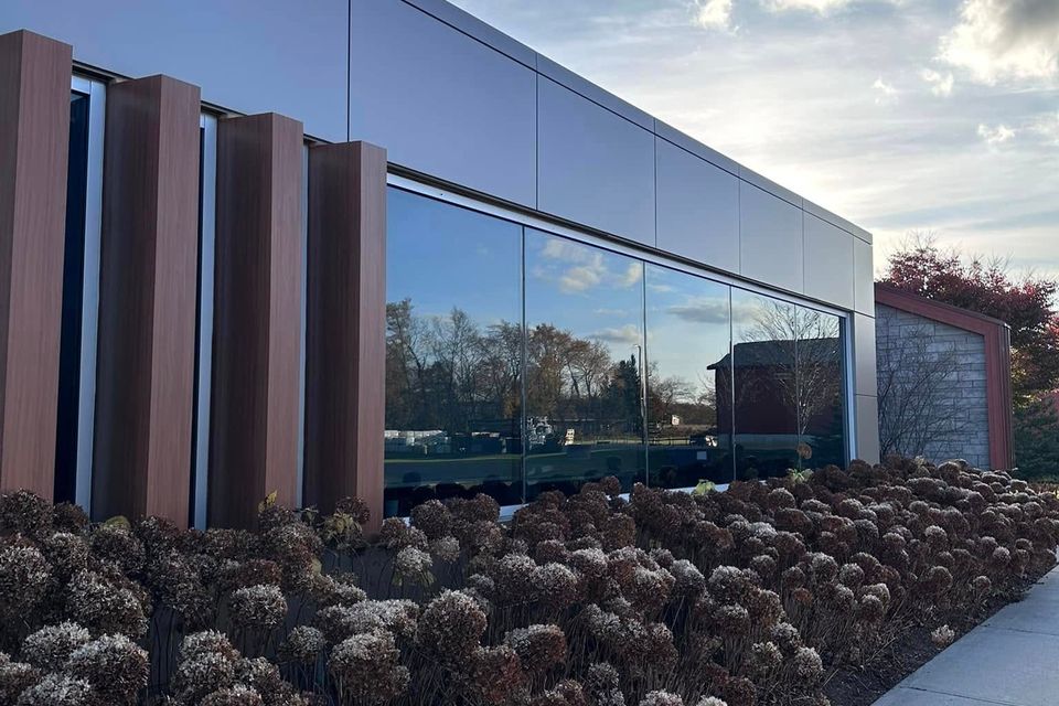 Spotless floor-to-ceiling glass on a modern commercial building after window washing in Tillsonburg Ontario