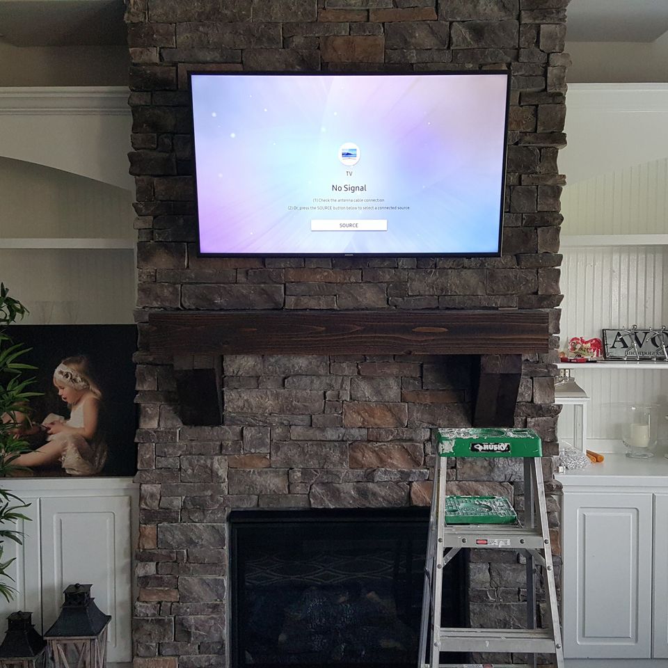 Flat panel tv mounted over a stone fireplace in greenville sc (2)