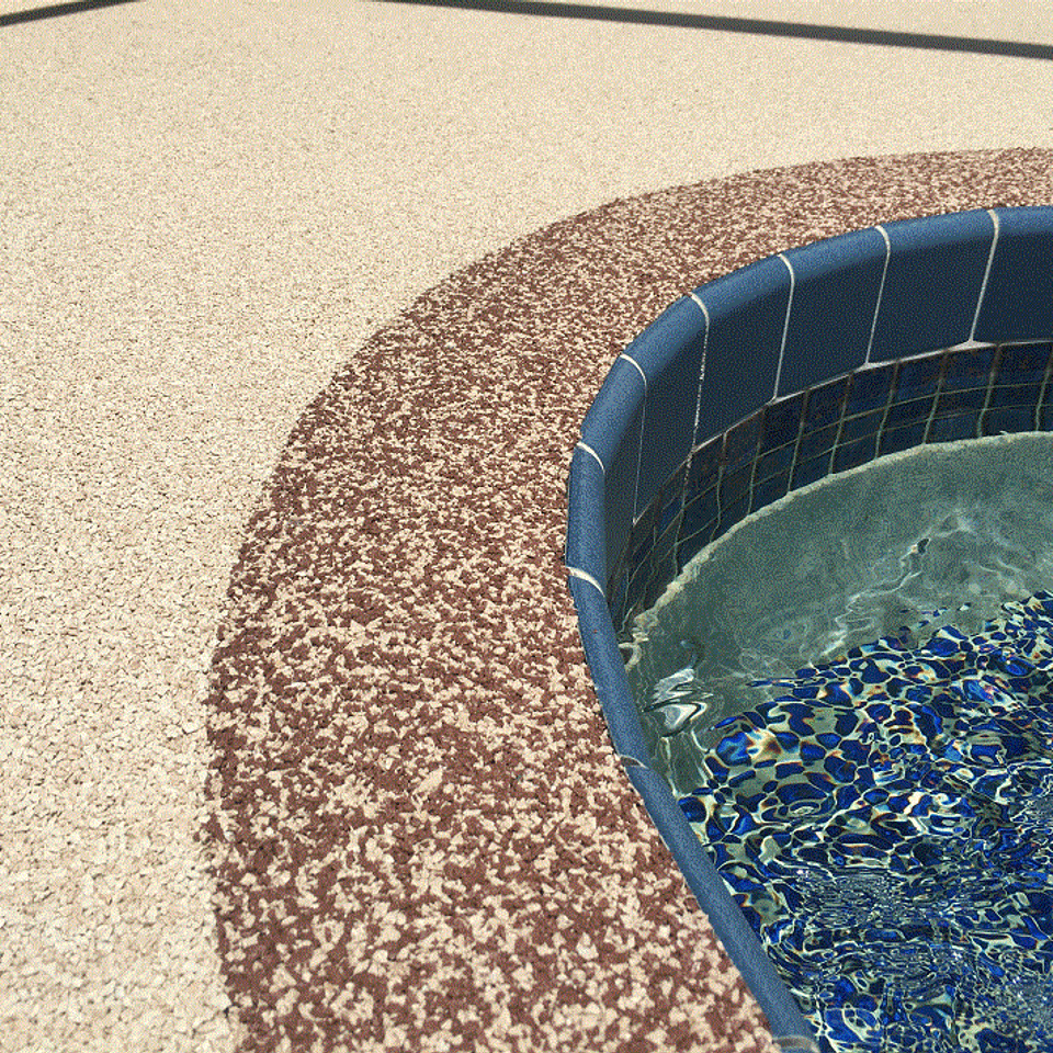 Close-up of an EverStone Flex textured surface installed around a swimming pool.