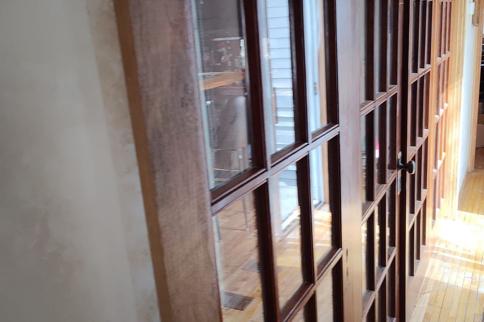 Frank's custom furniture finished installing tongue and groove flooringand french doors1