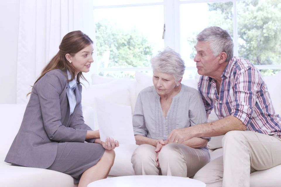 Senior couple discussing Medicare with agent