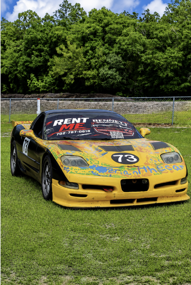 Yellow Grand-Am Cup Corvette race car rental for wheel-to-wheel track days in Carolina Beach NC
