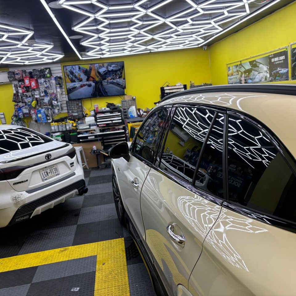 White Detailed Mercedes Benz SUV and Toyota Camry