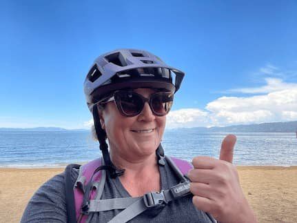 KPCopy embarking on her first bike ride since breaking her leg. At the beach with Lake Tahoe in the background