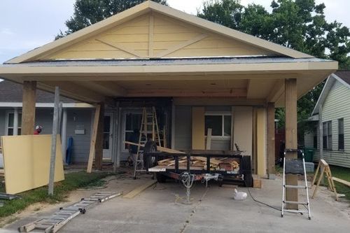 Freshly sheathed gable‑style carport roof in Conroe, TX