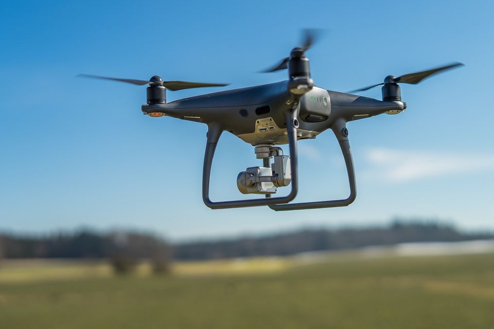 Drone flying in field 