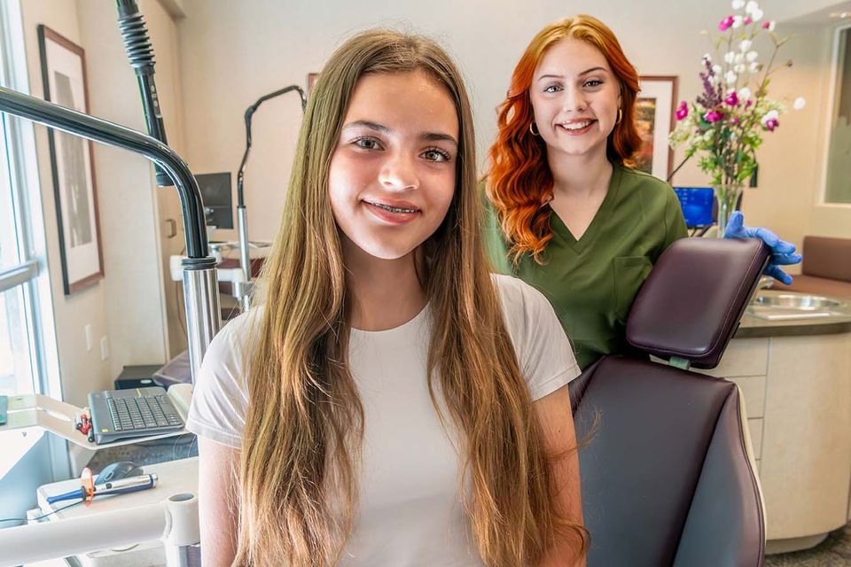 Teen girl with braces smiling at kelleher orthodontics