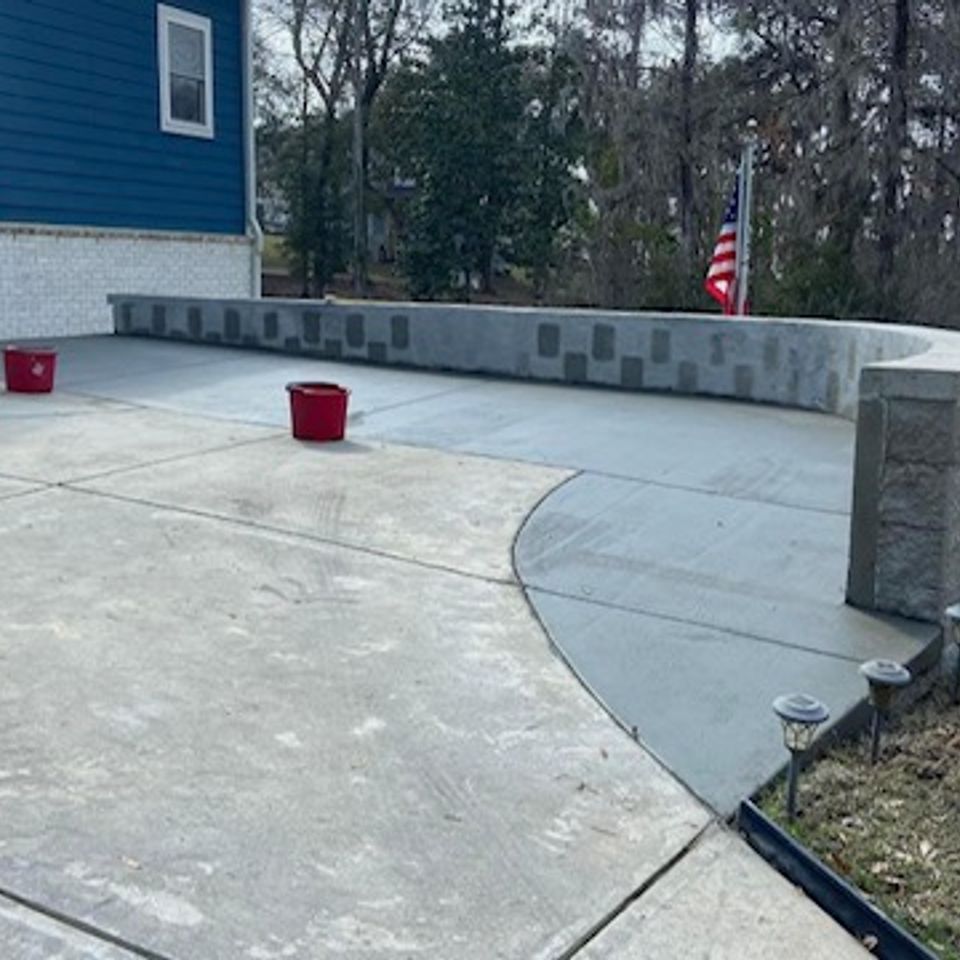 "Concrete driveway professionally constructed by Gabino Landscaping in Myrtle Beach, South Carolina."