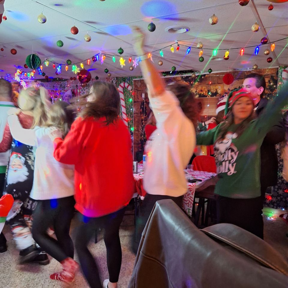People dancing and having fun at the Clark family holiday party